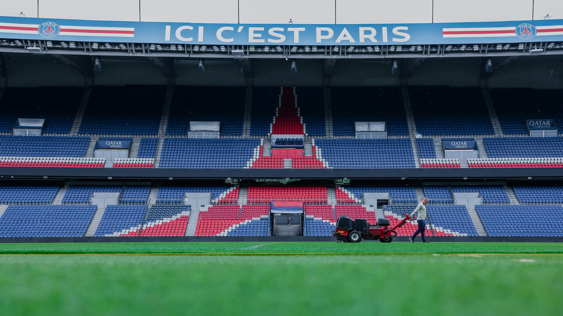 gardener maintains parc des princes field in paris